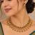 antique gold-tone necklace set with ruby and green stones