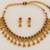 antique gold-tone necklace set with ruby and green stones
