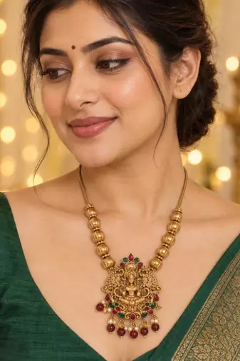 traditional gold-tone lakshmi pendant necklace with multicolour stone