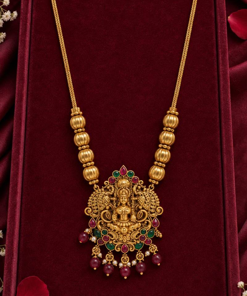 traditional gold-tone lakshmi pendant necklace with multicolour stone
