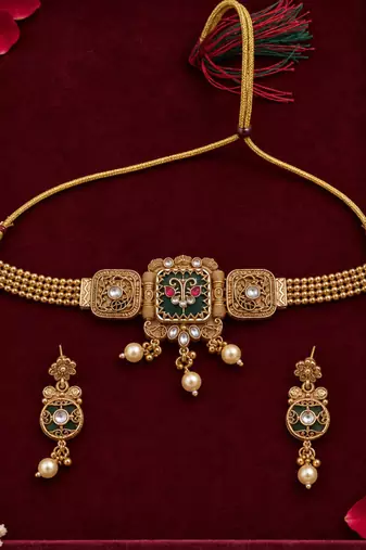 antique gold-tone necklace set with green enamel pendant
