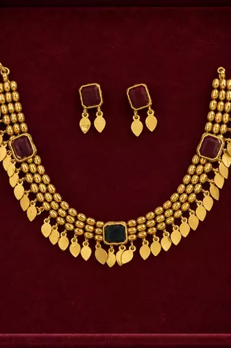 gold necklace with multicolor stone accents