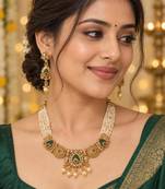 gold necklace with multistrand white beads