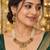 gold necklace with multistrand white beads