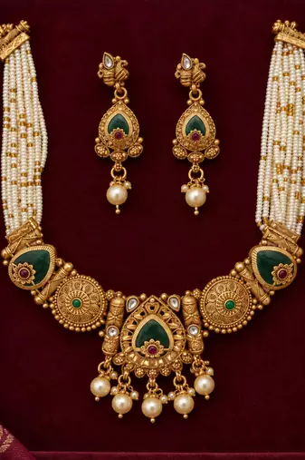 gold necklace with multistrand white beads