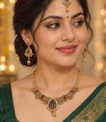 gold heritage necklace with floral pendant