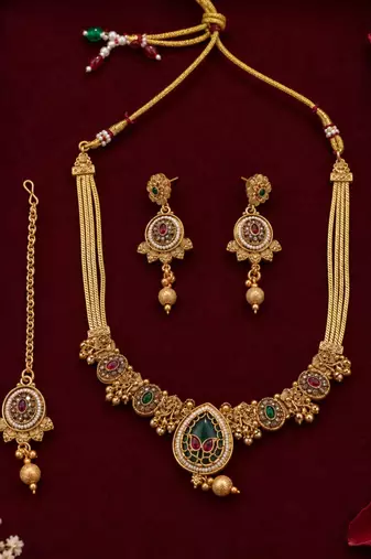 gold heritage necklace with floral pendant
