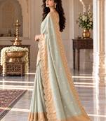Light-sea-green silk embroidered saree withcutdana work