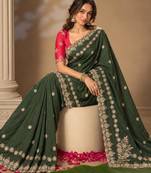 Dark-green silk embroidered saree withcutdana work
