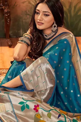 Blue ethnic motifs woven design zari paithani saree