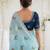 Blue woven design mirror work georgette saree