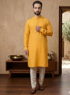 Elegant mustard yellow cotton men's kurta with cream pants 1