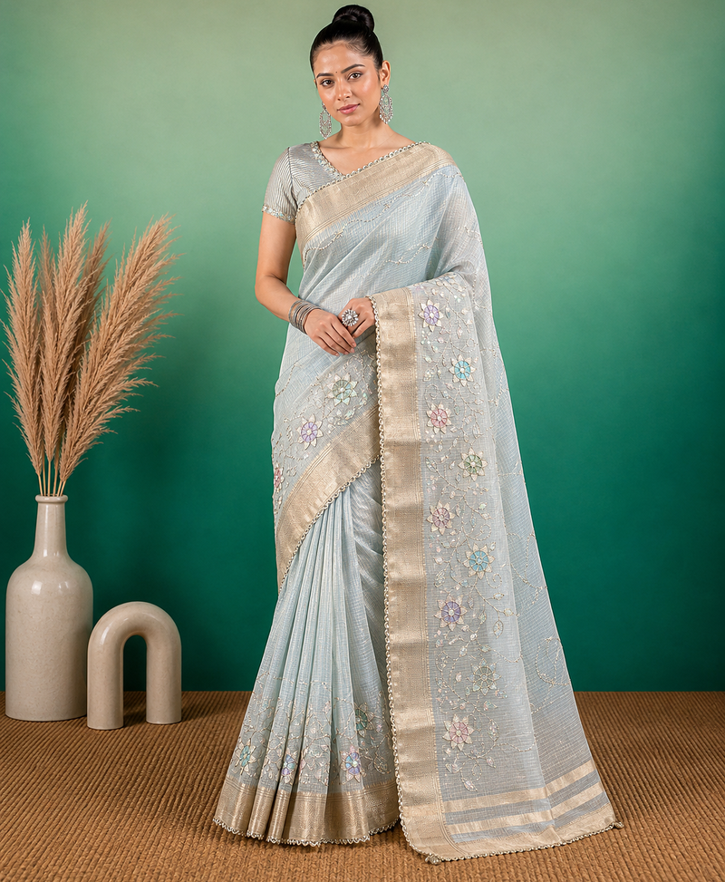 Light Blue embroidery beats sequin floral work and lightweight tissue linen saree with unstitched blouse