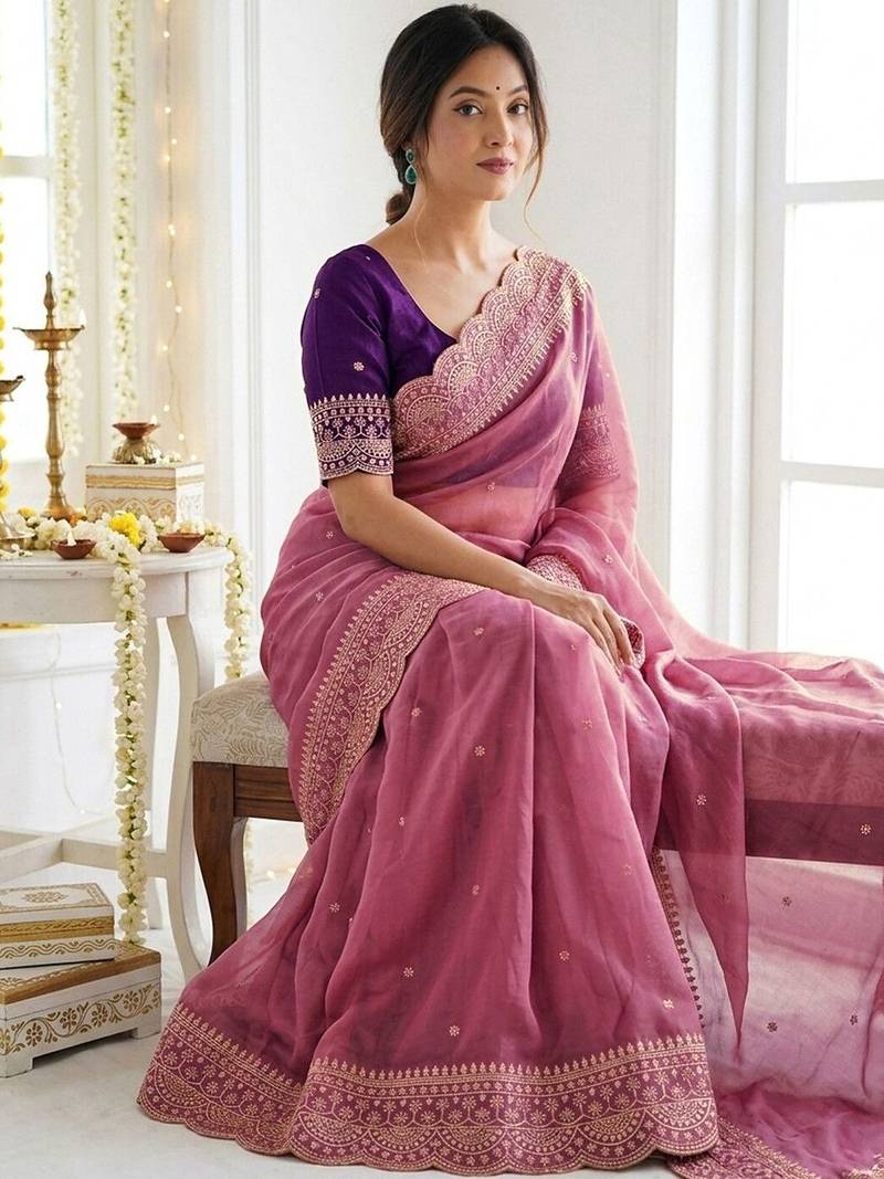 Pink ethnic motifs embroidered georgette saree with designer blouse