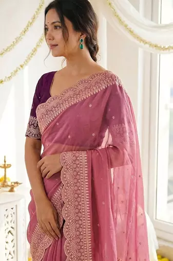 Pink ethnic motifs embroidered georgette saree with designer blouse