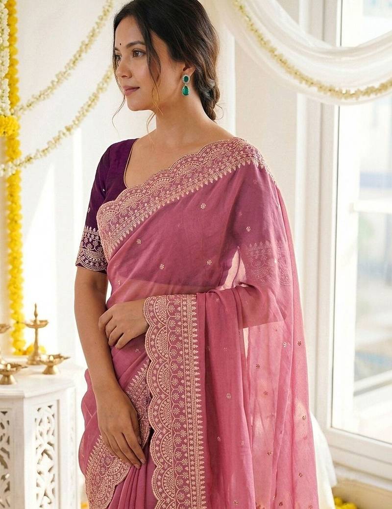 Pink ethnic motifs embroidered georgette saree with designer blouse