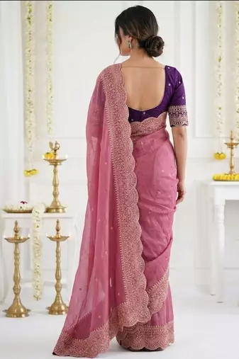 Pink ethnic motifs embroidered georgette saree with designer blouse