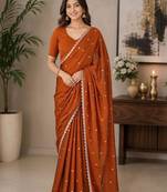 Rust woven design embroidered art silk saree