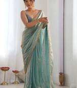 Turquoise tissue sequence embroidered saree with blouse piece