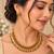 Antique gold-tone coin necklace set with pink and green accents
