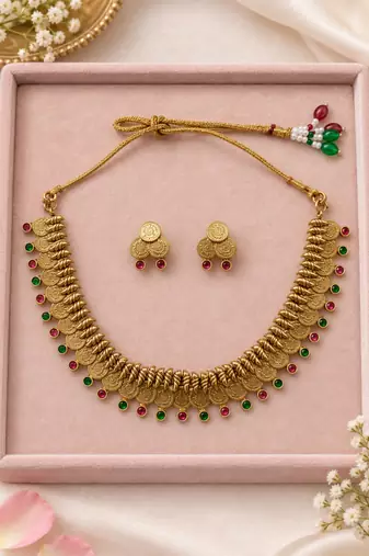 Antique gold-tone coin necklace set with pink and green accents