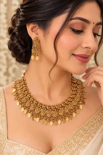 Antique gold-tone temple necklace set with paisley charms and earrings