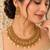 Antique gold-tone temple necklace set with paisley charms and earrings