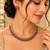Gold-tone necklace set with alternating pink and green teardrop stones