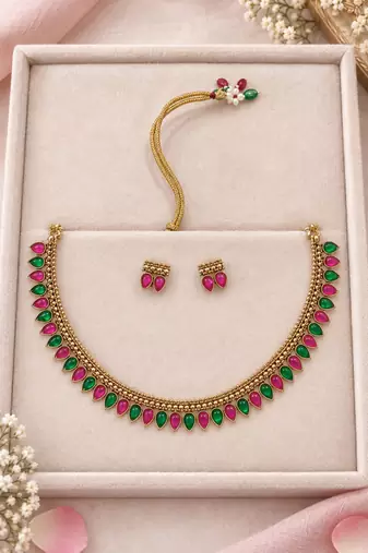 Gold-tone necklace set with alternating pink and green teardrop stones