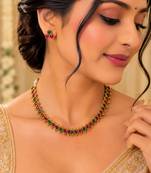 Gold-tone ruby and emerald round stone necklace set with earrings