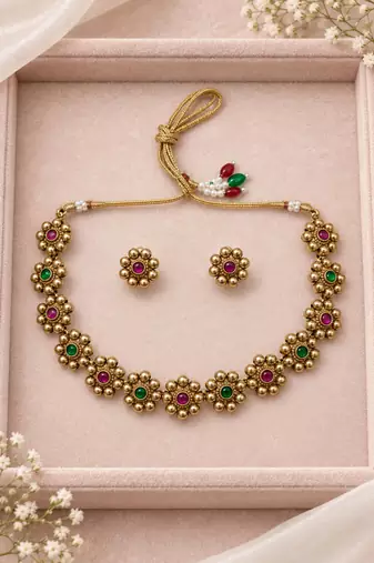 Antique gold-tone floral bead necklace set with red and green accents