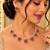 Gold-tone pearl necklace set with pink and green floral motifs