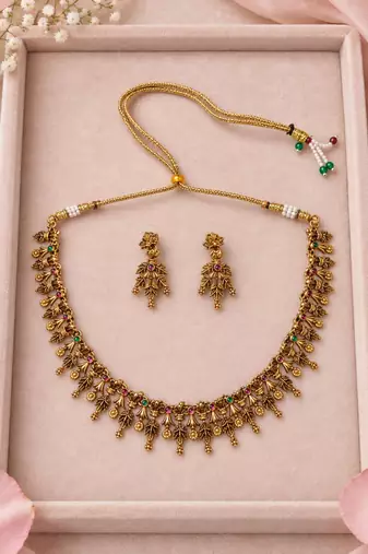 Antique gold-tone floral leaf necklace set with dangling charms