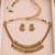 Antique gold-tone coin necklace set with matching coin drop earrings