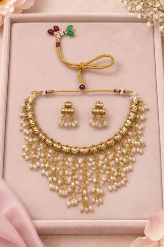 Gold-tone pearl fringe necklace set with traditional earrings