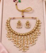 Gold-tone pearl fringe necklace set with traditional earrings