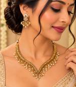 Antique gold-tone v-shaped necklace set with pearl dangles