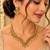 Antique gold-tone v-shaped necklace set with pearl dangles