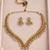 Antique gold-tone v-shaped necklace set with pearl dangles