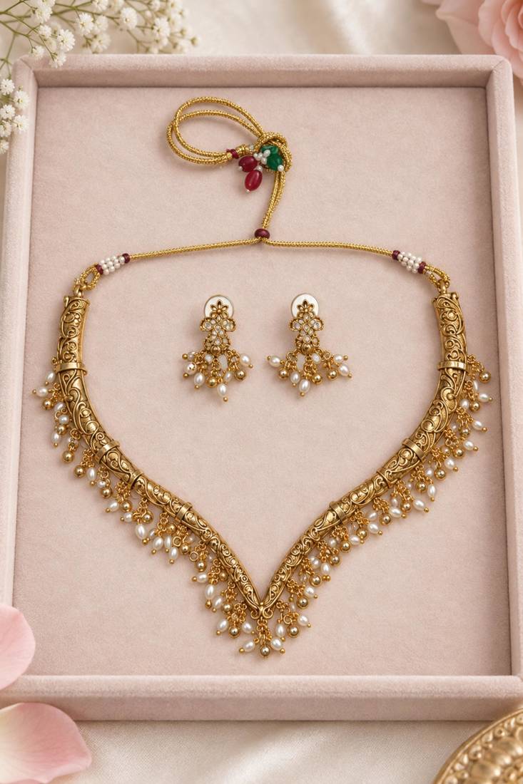 Antique gold-tone v-shaped necklace set with pearl dangles