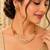 Gold-tone multi-strand pearl necklace set with traditional stud earrings