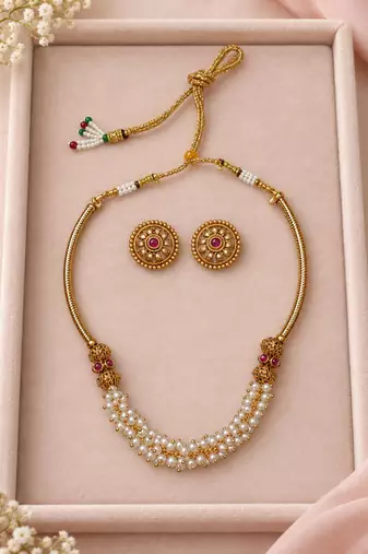 Gold-tone multi-strand pearl necklace set with traditional stud earrings