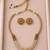 Gold-tone multi-strand pearl necklace set with traditional stud earrings