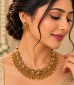 Antique gold-tone temple necklace set with traditional motif earrings