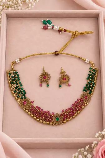 Gold-tone floral necklace set with green and pink beads