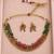 Gold-tone floral necklace set with green and pink beads