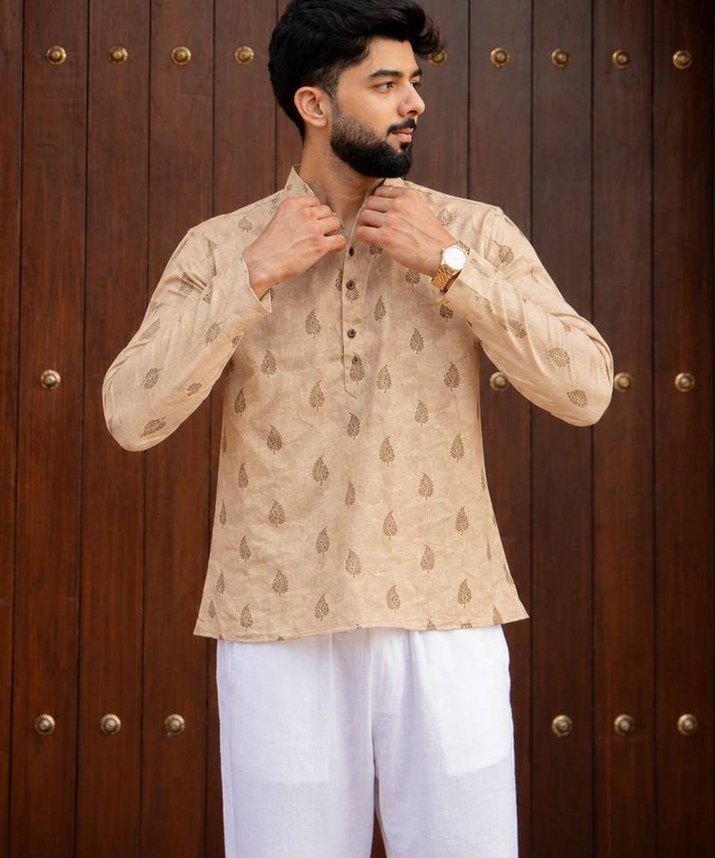 Peach color smart and ethnic swiss linen fabric fetive printed short kurta for men's trendy looks