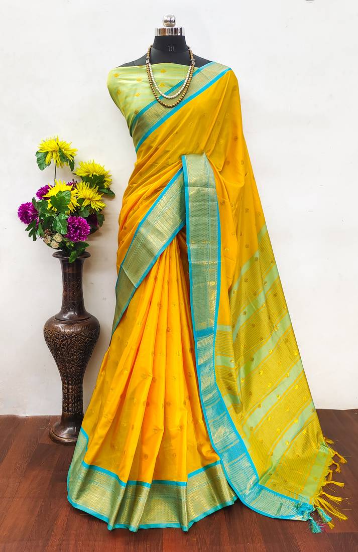 Golden yellow zari woven silk blend traditional saree with blouse