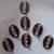 7 long oval shape maroon bindi with silver decorations