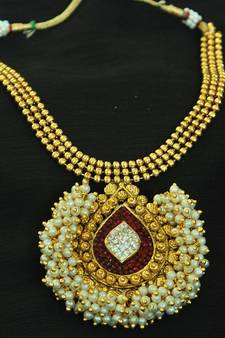 Stunning Maroon colour Gold Plated Necklace set studded with American Diamond stones